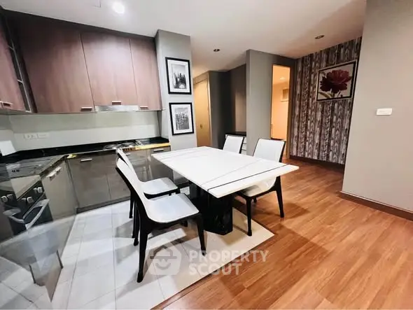 Modern kitchen with sleek dining area and stylish decor