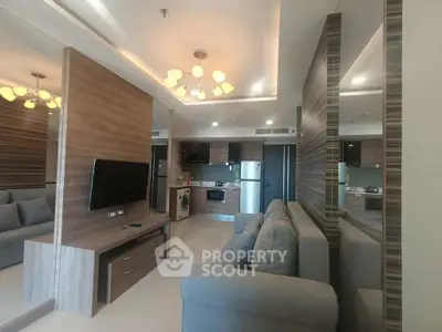 Modern living room with sleek design, featuring a cozy sofa, wall-mounted TV, and stylish lighting.