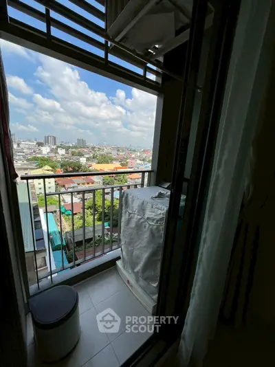 Charming balcony with city view, perfect for relaxation and enjoying the skyline.