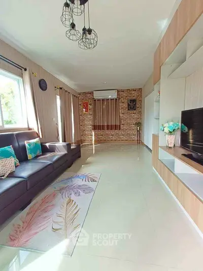 Spacious living room with modern decor and natural light