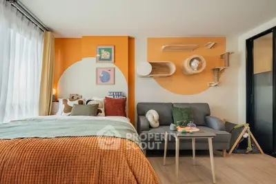 Stylish modern studio with vibrant decor and cozy furnishings, perfect for urban living.