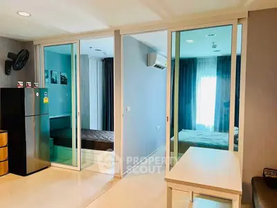 Modern apartment interior with sliding glass doors and natural light