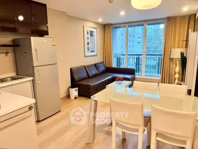 Modern living room with open kitchen, featuring sleek furniture and large windows with city view.