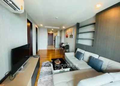 Modern living room with stylish decor and comfortable seating in a contemporary apartment.