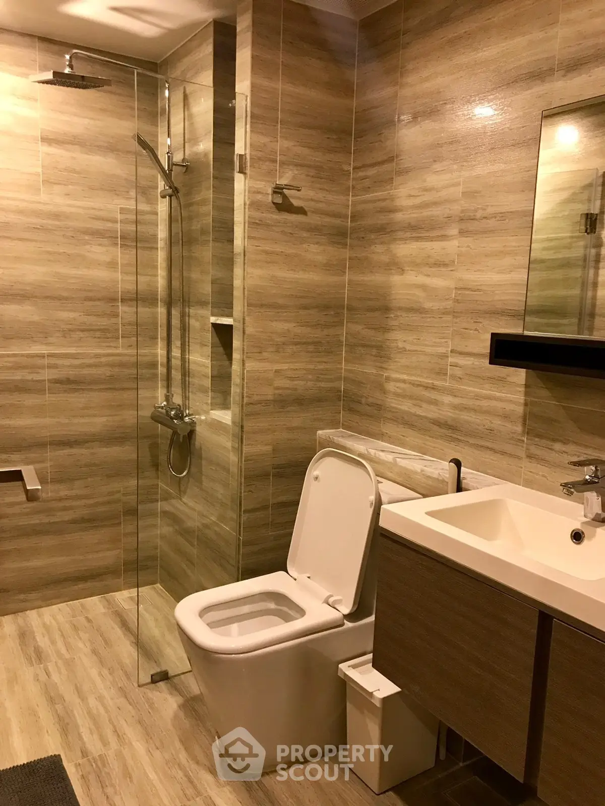 Modern bathroom with glass shower and sleek fixtures