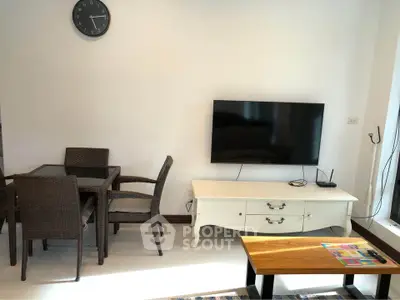 Modern living room with wall-mounted TV and stylish furniture