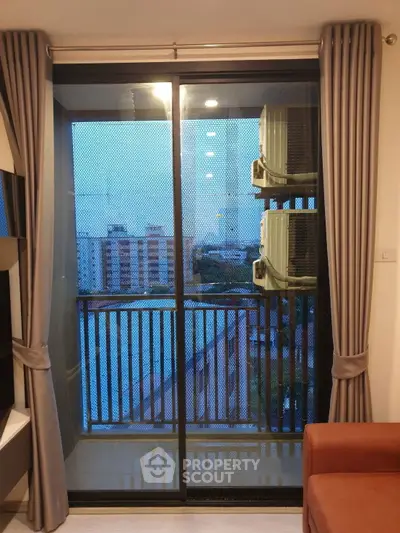 Modern apartment balcony with city view and air conditioning units