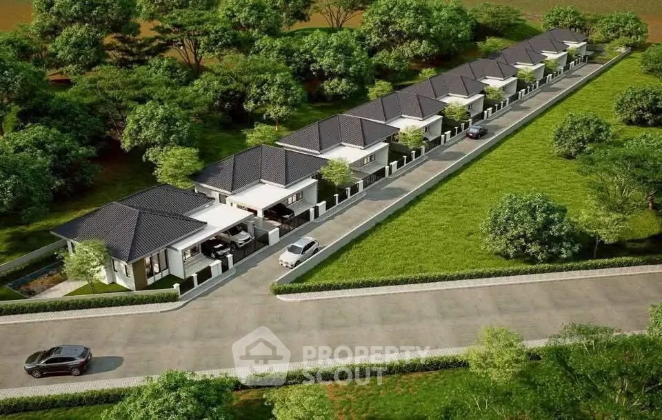 Aerial view of modern single-story homes in a lush green neighborhood.