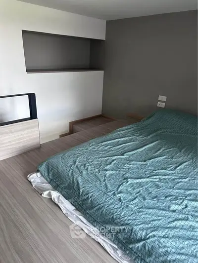 Modern minimalist bedroom with sleek design and cozy atmosphere.