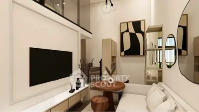 Modern living room with stylish decor and wall-mounted TV in a cozy apartment.
