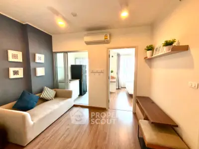 Modern living room with cozy sofa and open kitchen layout