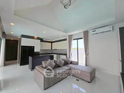 Spacious modern living room with open kitchen and elegant decor