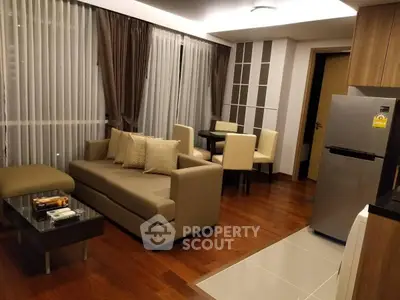 Modern living room with elegant furniture and open kitchen layout