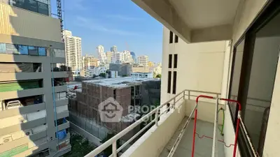 Spacious balcony with city view in modern urban apartment