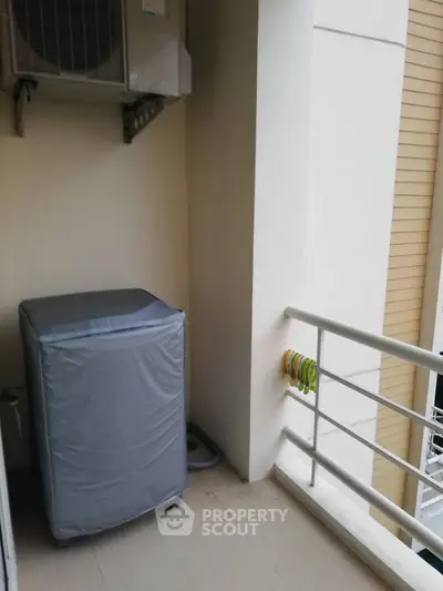 Compact balcony with washing machine and air conditioning unit