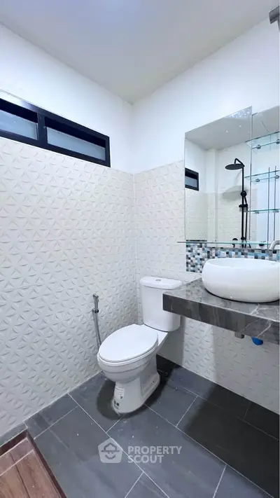 Modern bathroom with stylish tiles and sleek fixtures