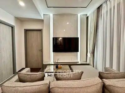 Modern living room with stylish decor and wall-mounted TV