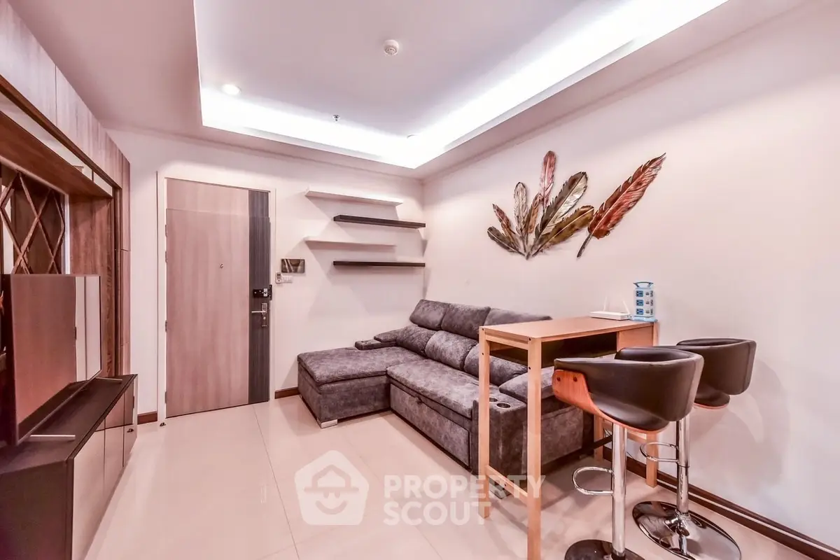 Modern living room with stylish decor and cozy seating in a contemporary apartment.