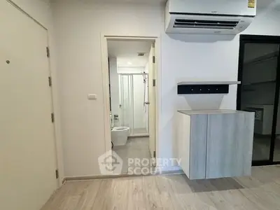Modern apartment interior with air conditioning and bathroom view