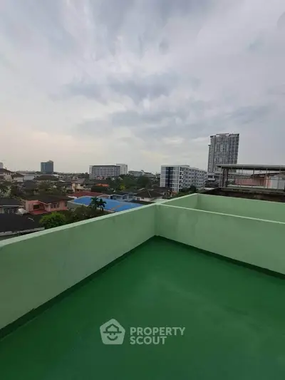 Stunning rooftop view with cityscape backdrop, perfect for urban living enthusiasts.