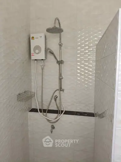 Modern bathroom shower with sleek white tiles and water heater