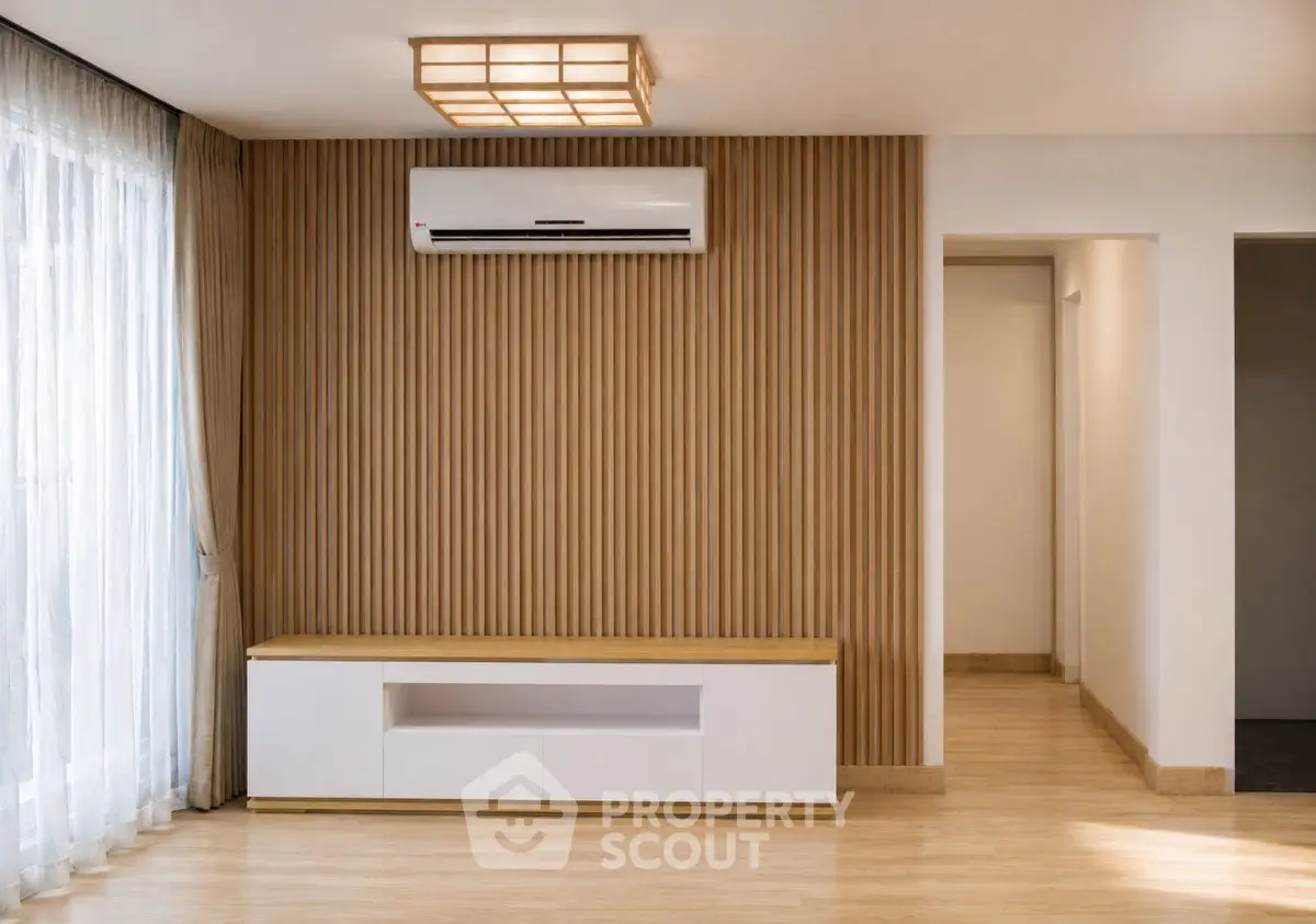 Modern living room with wooden panel wall and air conditioning unit