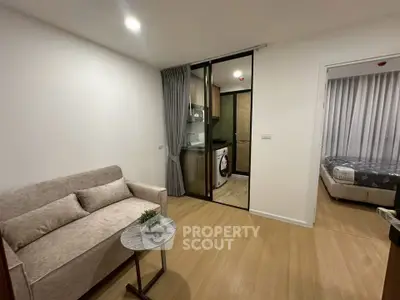 Modern apartment interior with cozy living room and adjacent bedroom