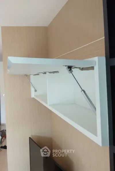 Modern interior with sleek wall-mounted storage cabinet and TV unit
