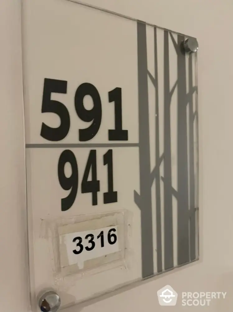 Modern apartment unit number sign with sleek design