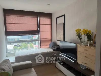 Cozy bedroom with large window and modern decor, featuring a comfortable bed and stylish furniture.