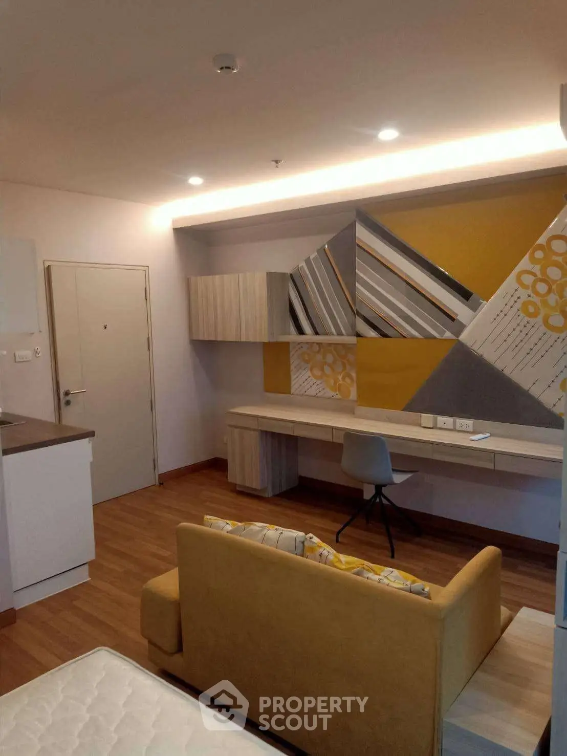 Modern studio apartment with stylish decor and functional workspace