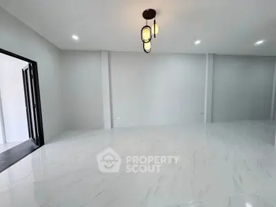 Spacious modern living room with elegant lighting and sleek flooring