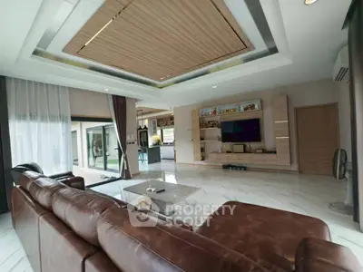 Luxurious living room with leather sofa and modern entertainment center