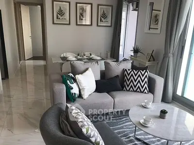 Modern living room with stylish decor and elegant dining area