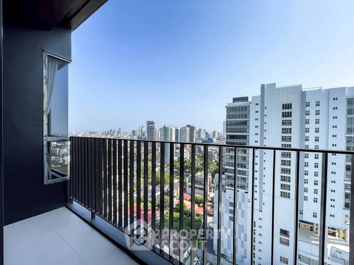 Stunning cityscape view from a modern high-rise balcony, perfect for urban living enthusiasts.