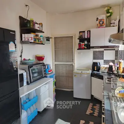 Cozy kitchen with modern appliances and ample storage space.