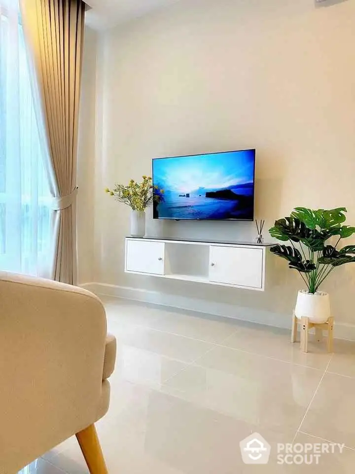 Modern living room with sleek TV setup and elegant decor