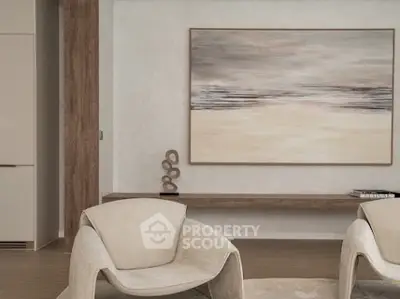 Modern living room with stylish chairs and abstract art on the wall