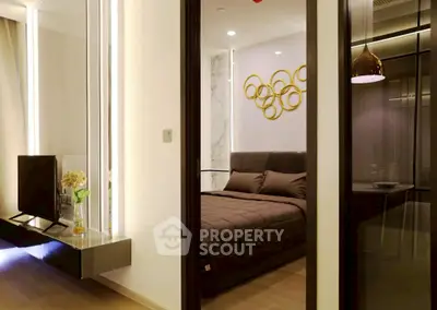 Modern bedroom with stylish decor and ambient lighting in a luxury apartment.