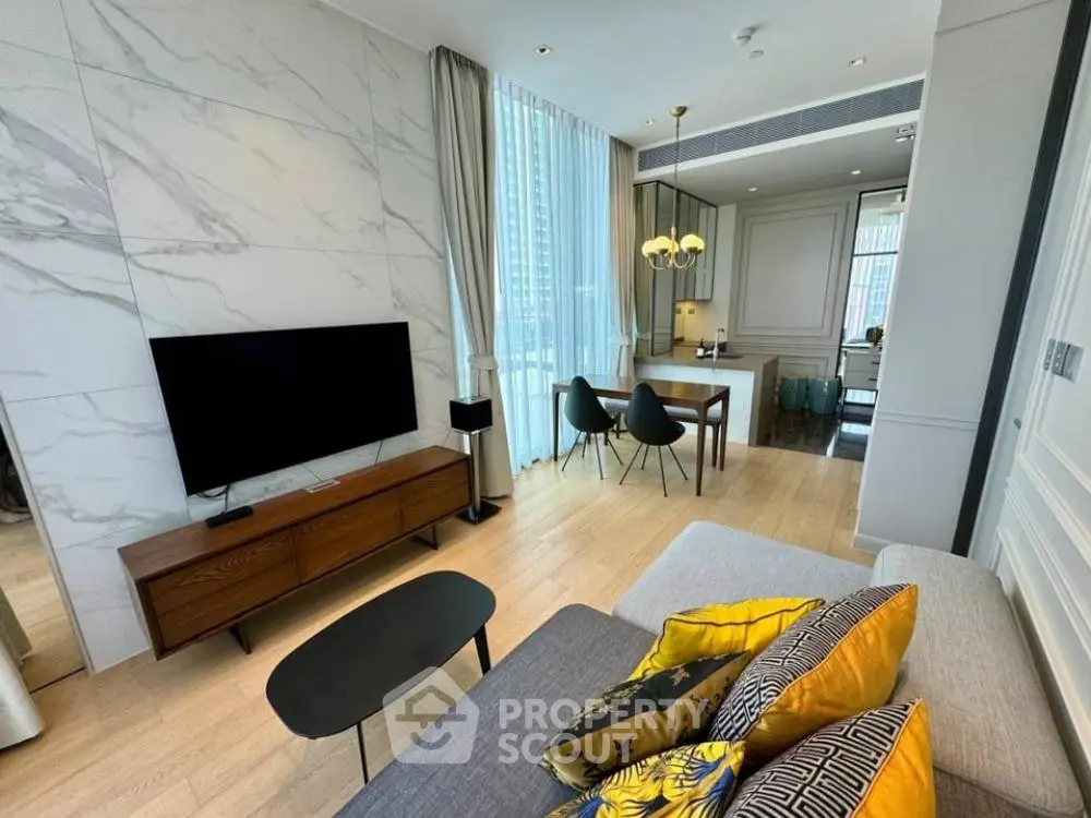 Modern living room with stylish decor and large windows in a luxury apartment.