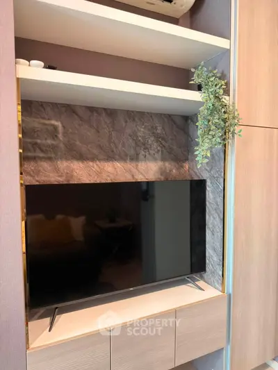 Modern living room with sleek TV unit and stylish decor