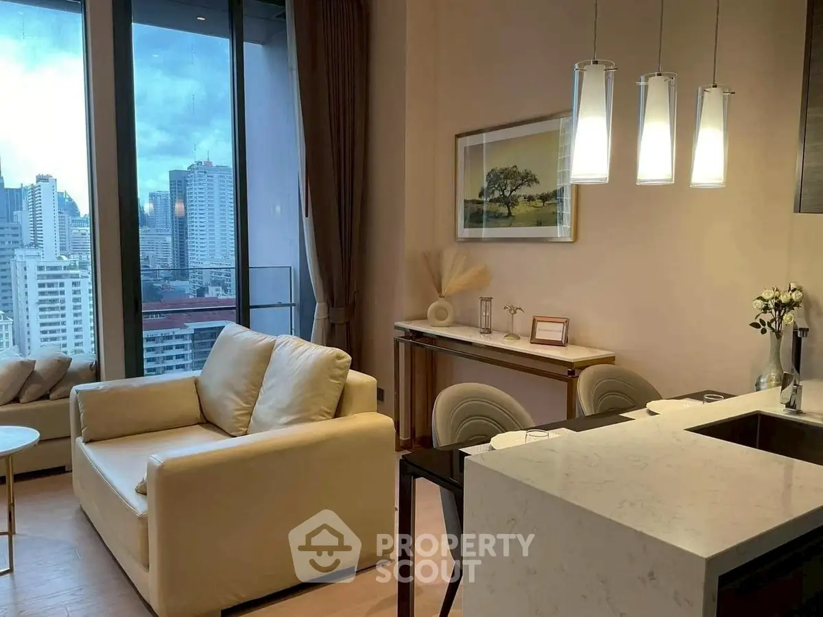 Modern living room with city view, elegant decor, and open kitchen layout.
