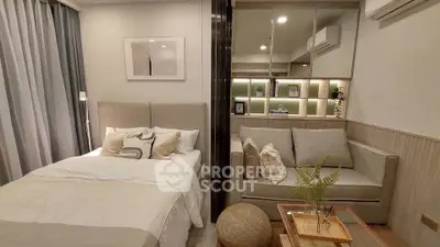 Modern studio apartment with cozy bed and stylish living area