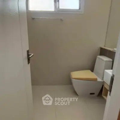 Modern bathroom with sleek fixtures and neutral tones