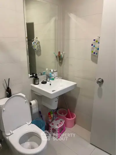 Modern bathroom with sleek fixtures and ample storage space.