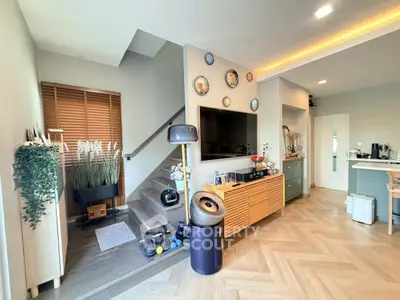 Stylish modern living room with wooden flooring and elegant decor