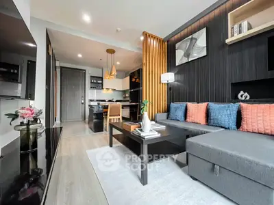 Modern living room with stylish decor and open kitchen layout in a contemporary apartment.