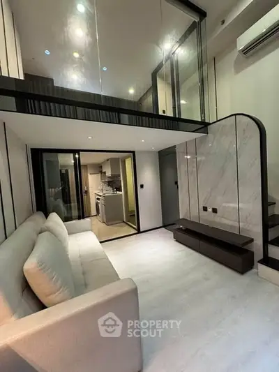 Modern living room with mezzanine and sleek design in a stylish apartment.
