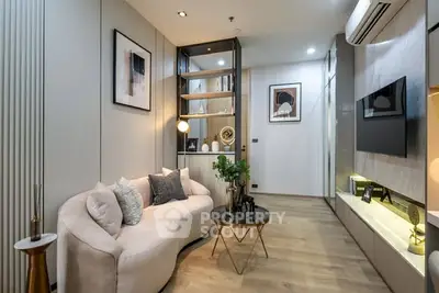 Modern living room with stylish decor and cozy seating area, perfect for relaxation and entertainment.