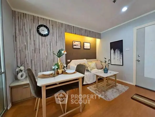 Charming living room with modern decor and cozy seating area, perfect for relaxation and entertaining.